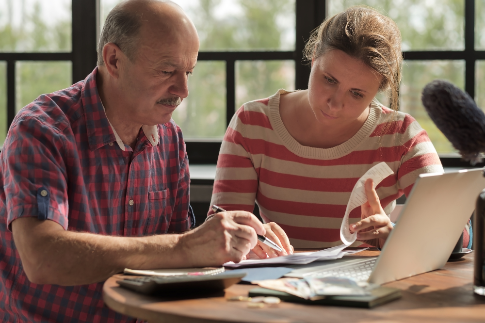 Image of a Couple Working on Taxes